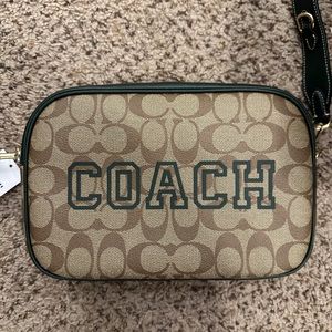 BNWT!! Coach Crossbody. The color is Brown & Hunter Green.